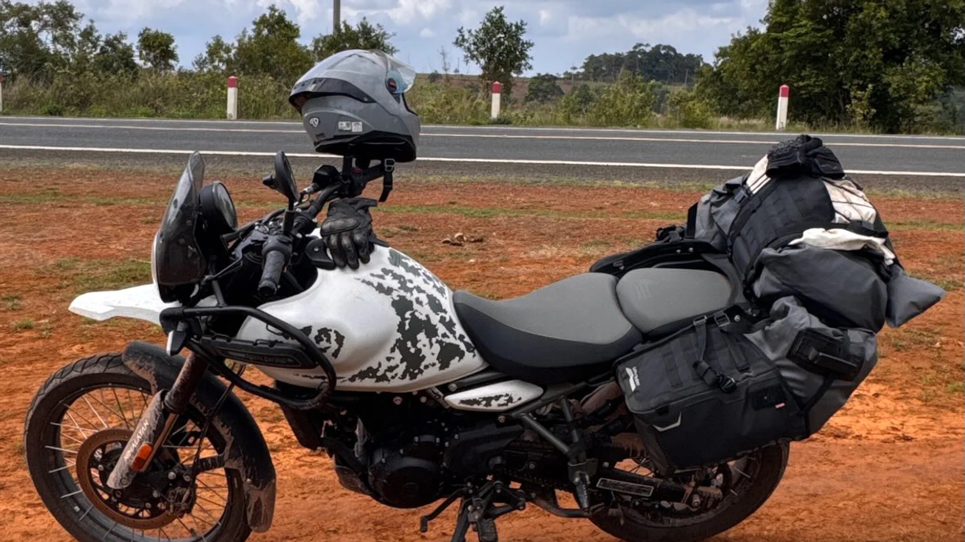 Our loaded motorbike on Mondulkiri's red earth during the 2,500 km loop