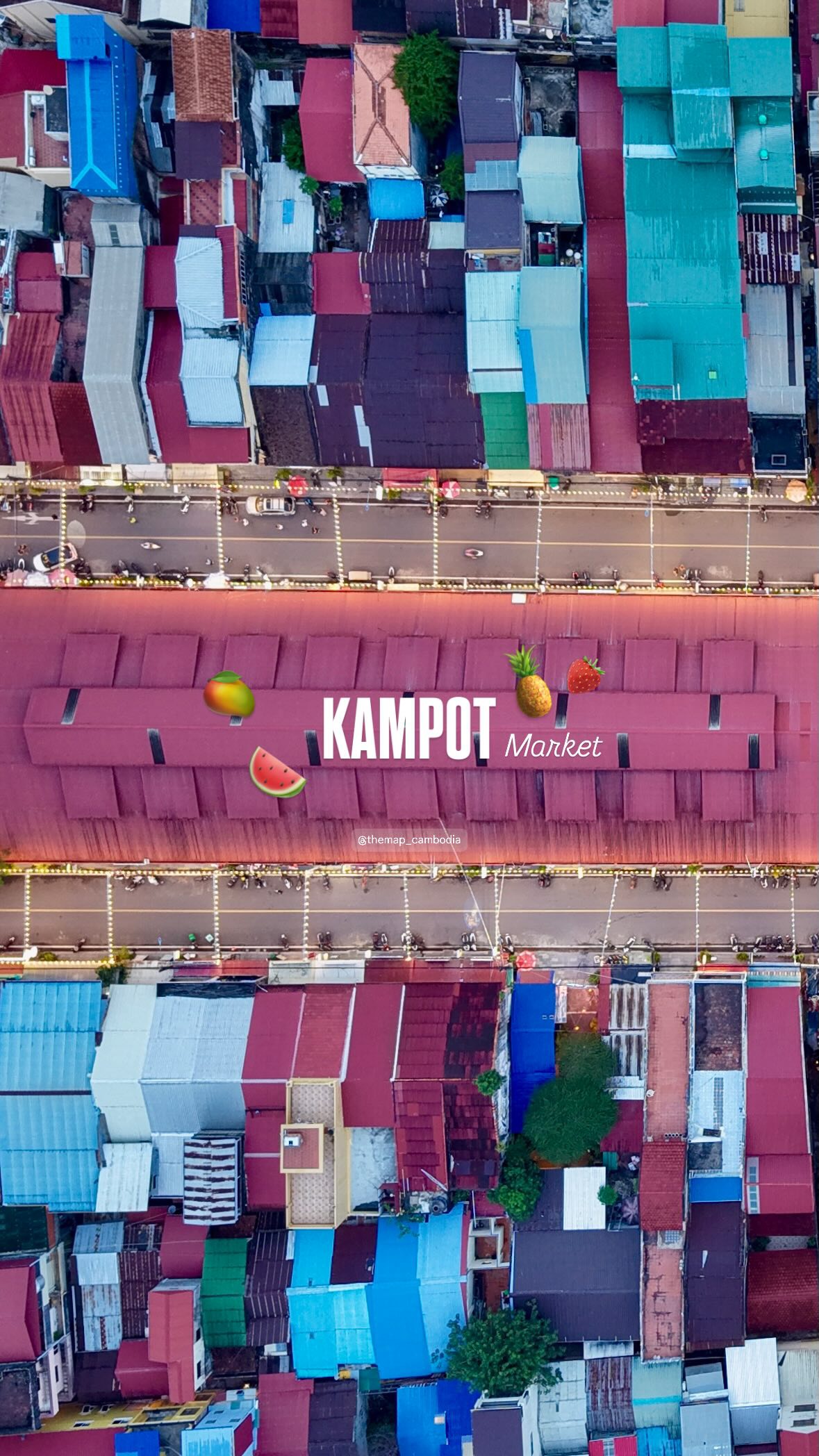 The vivid roofs of Kampot Market beside the river